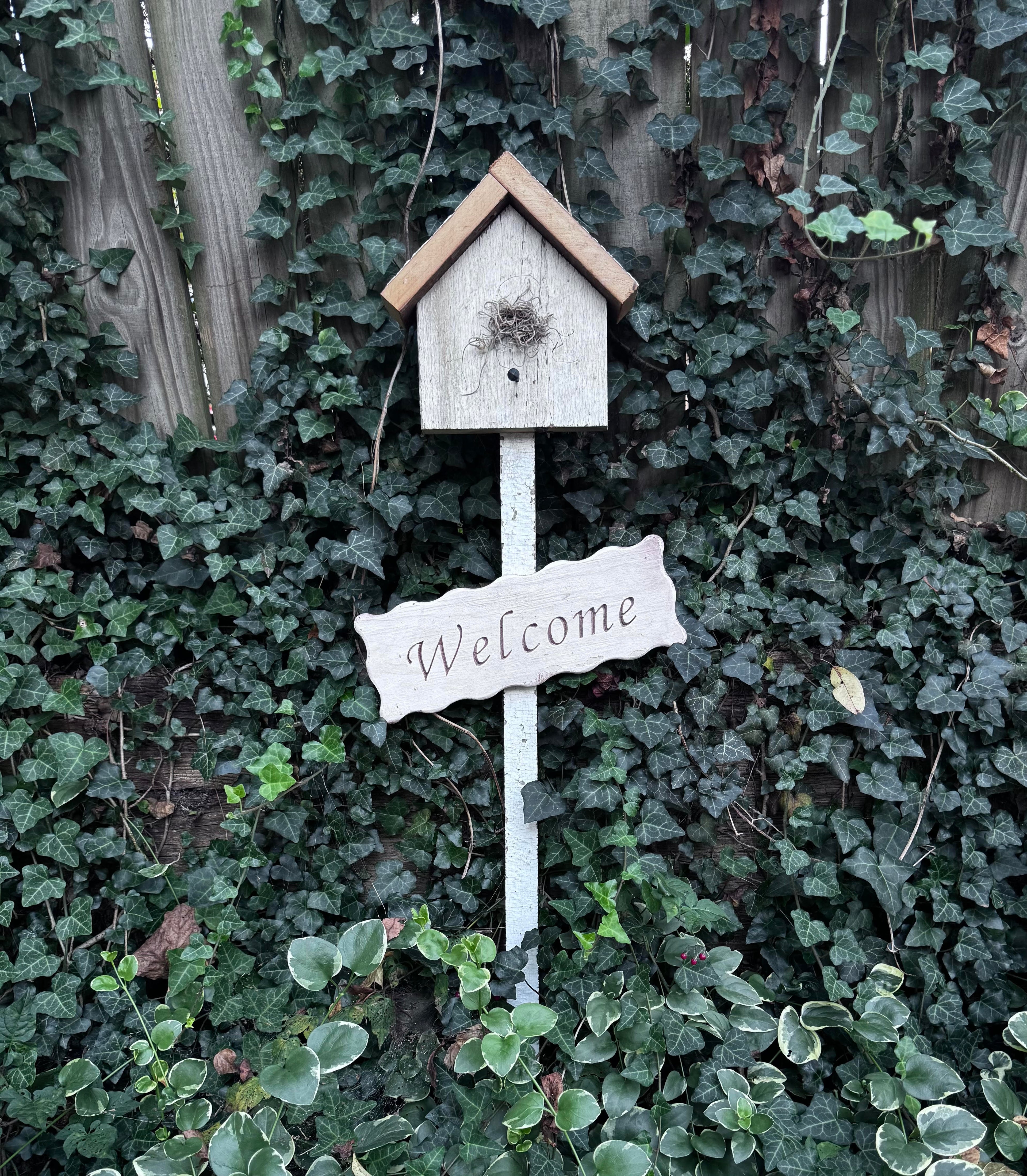 White Welcome Sign post